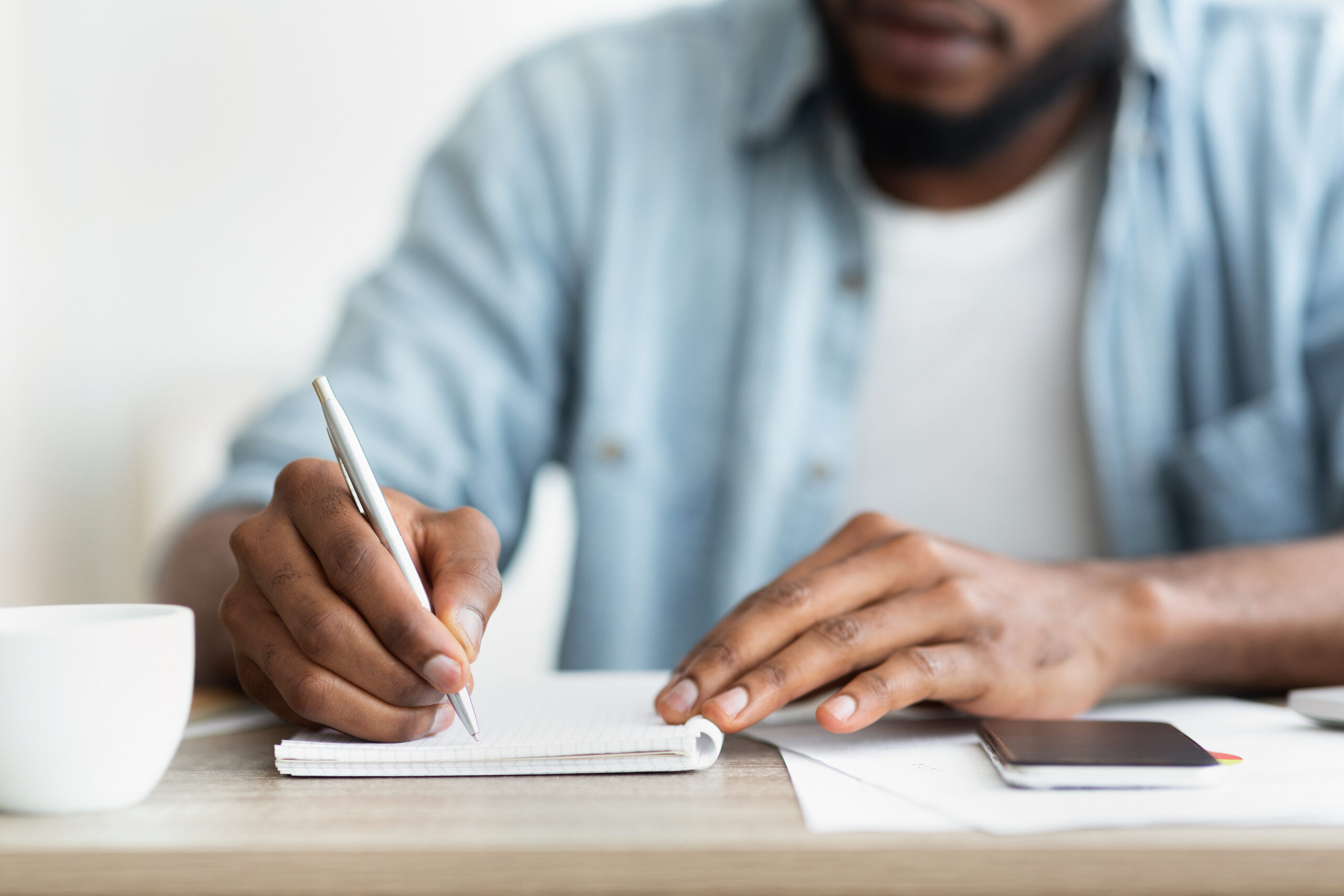 African american businessman writing down his estate plan