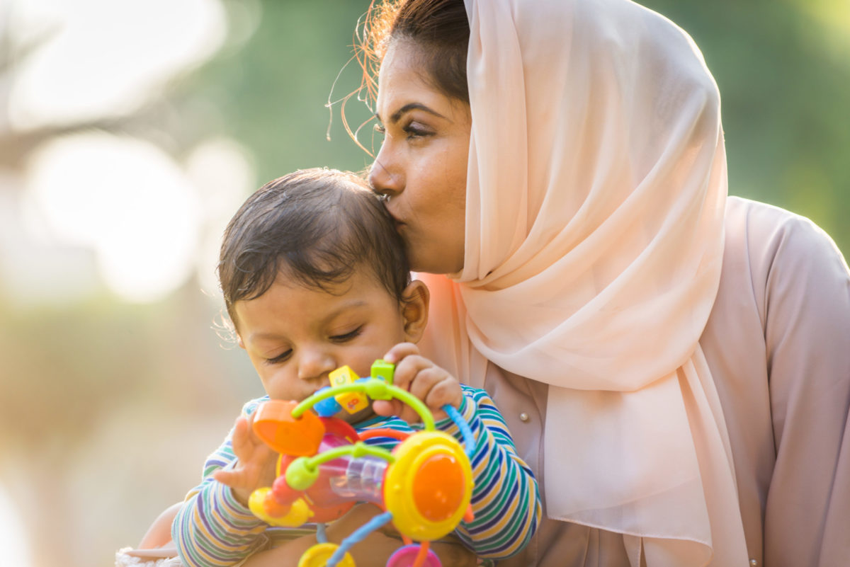 Arabic mom and her little toddler playing outdoors - Estate Planning for minors